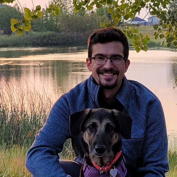 Dr.Sabastian-Ruskowski with dog at a lake